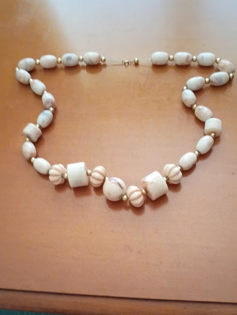 Handcrafted Cream Beaded Necklace with Gold Accents